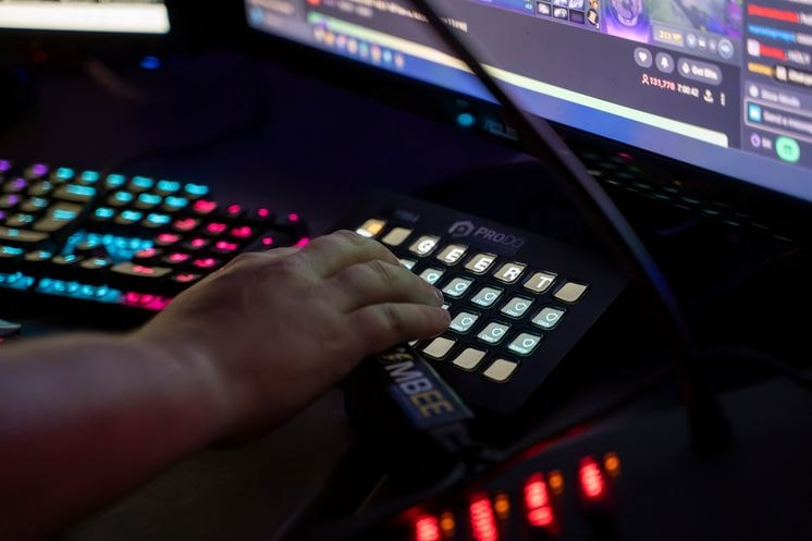 Hand pressing Buttons on a Stream Deck
